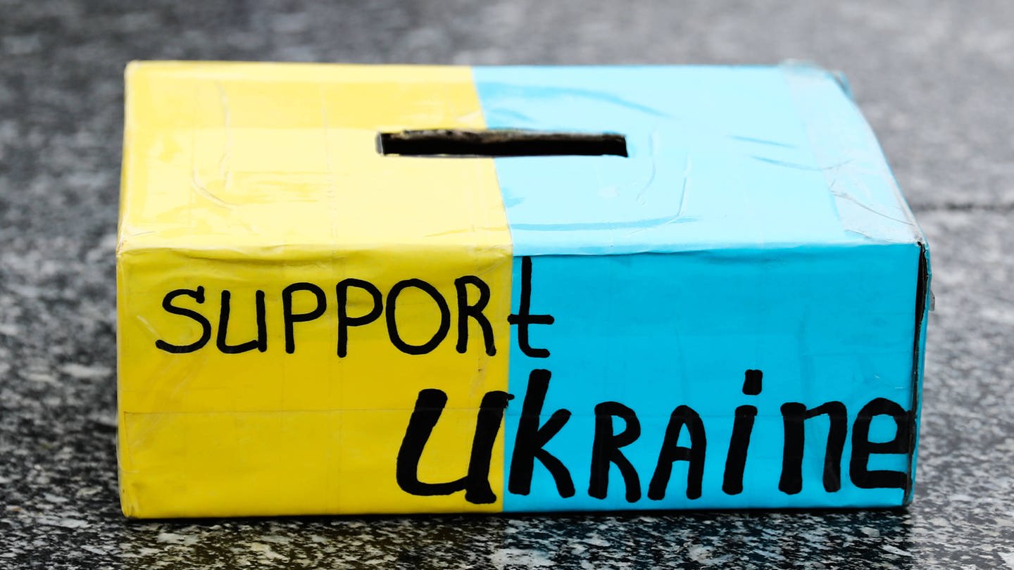 Ukrainians Demonstration In Krakow A money box with support Ukraine writing is seen during the demonstration in Krakow, Poland