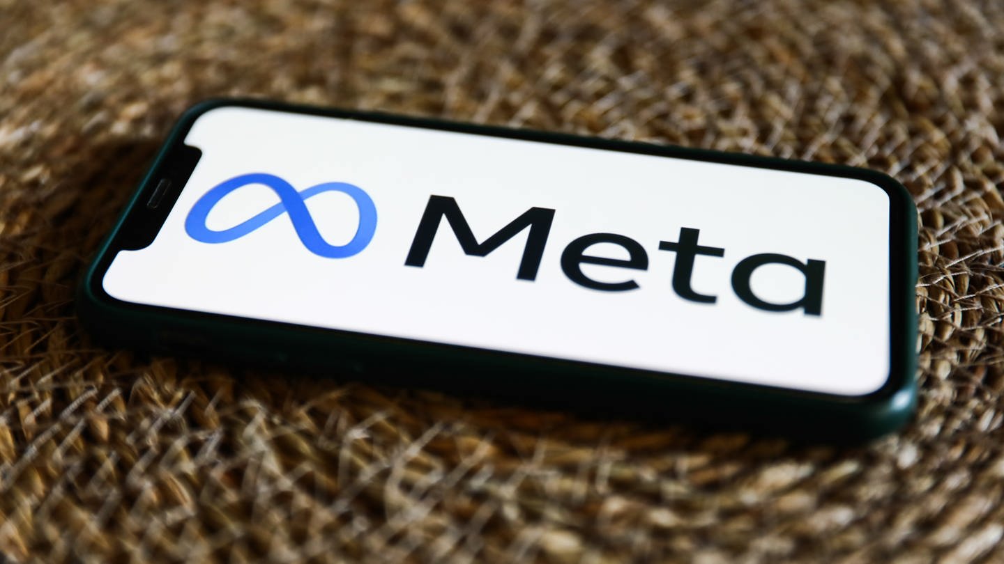 Meta logo displayed on a phone screen.