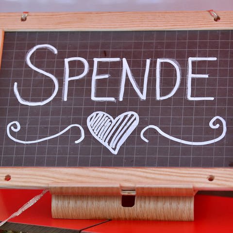 Ein Schild, auf dem das Wort "Spende" steht. (Symbolbild) (Foto: IMAGO, Maximilian Koch)