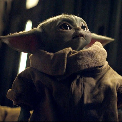 Baby Yoda aus der Serie "The Mandalorian". Das "Star Wars"-Franchise hat einen neuen Kinofilm zu der erfolgreichen Serie angekündigt. (Foto: picture-alliance / Reportdienste, picture alliance/dpa/Lucasfilm/Disney+ | Lucasfilm)