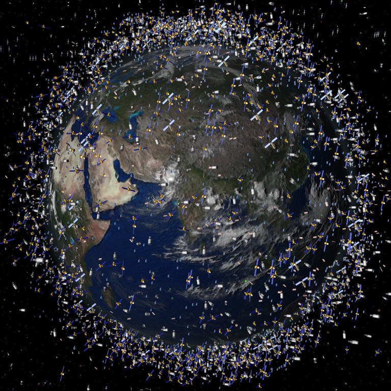 Das computergenerierte Bild der European Space Agency (ESA) zeigt Weltraummüll früherer Weltraummissionen, der neben intakten Satelliten um die Erde kreist (Foto: dpa Bildfunk, picture alliance/dpa/ESA | ESA)