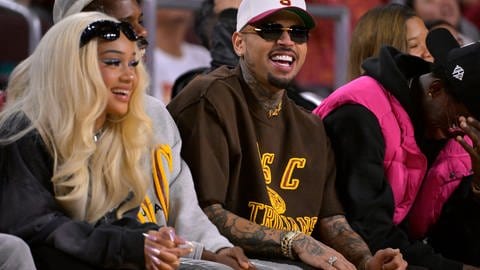 NCAA, College League, USA Womens Basketball: UCLA at Southern California Jan 14, 2024; Los Angeles, California, USA; Rapper Saweetie, fashion designer Tracey Mills and singer-songwriter Chris Brown attend the game between the USC Trojans and the UCLA Bruins at Galen Center.